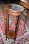 An Edwardian circular mahogany two tier plant stand, 81cm high
