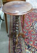 Victorian mahogany wine table with circular top over a barley twist column and tripod base, 72cm