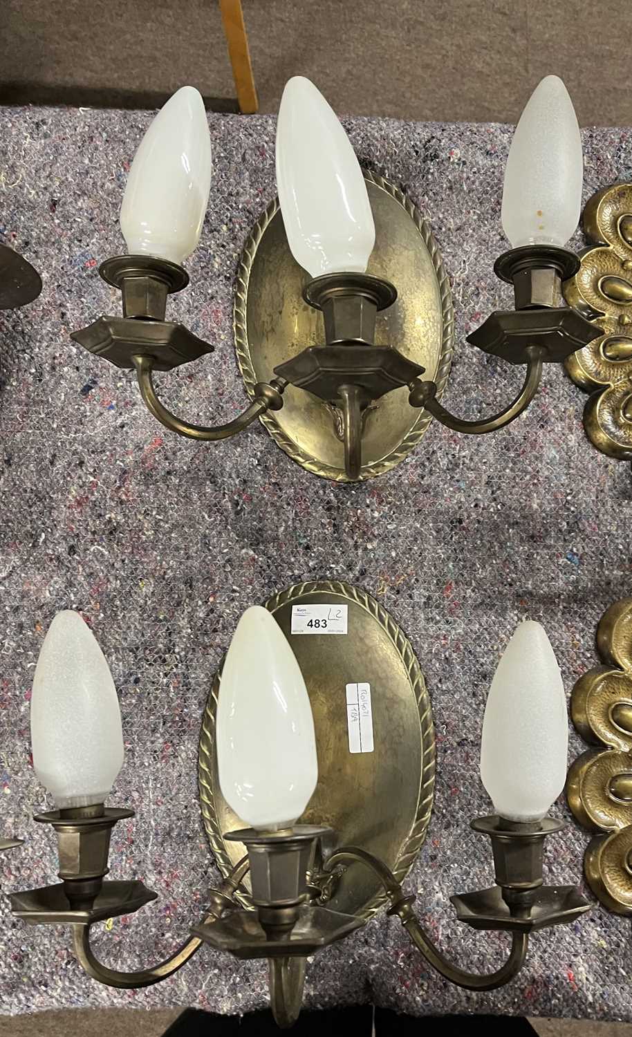 A pair of 20th Century brass three branch wall lights with oval panelled backs, 24cm high - Image 3 of 3