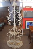 A white painted cast iron hall stand with pierced foliate decoration, 185cm high