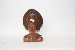 A carved wooden head, possibly Balinese