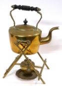 A brass kettle on stand with spirit container below
