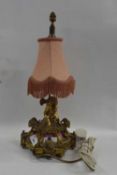 A gilt brass table lamp with porcelain panels