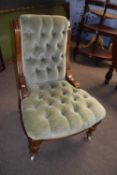 A late Victorian green button upholstered nursing chair