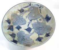 A Chinese porcelain dish with blue and white floral design, 28cm diameter (rim chips)