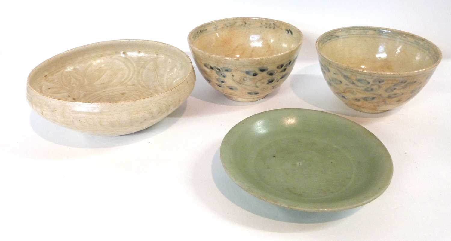 Group of four pottery dishes, one possibly Song Dynasty, further small plate with celadon ground,
