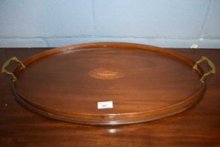 An Edwardian mahogany galleried oval serving tray with brass handles, 66cm wide