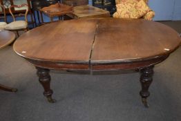 Large 19th Century mahogany extending dining table of oval form, set on turned legs, lacking its