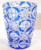 A heavy cut glass vase with hobnail cut and pale blue design, 18cm high