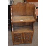 Late 19th or early 20th Century carved oak combination bookcase and cupboard with shelves over two