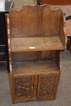 Late 19th or early 20th Century carved oak combination bookcase and cupboard with shelves over two