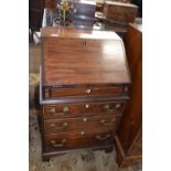 Small Georgian style mahogany bureau of narrow form with full front opening to an interior with