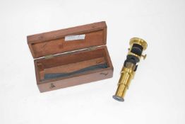 A small microscope in wooden case