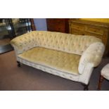 Victorian pale green draylon upholstered buttoned Chesterfield sofa with ball and claw feet and drop