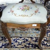A Victorian rosewood framed stool of serpentine form with tapestry covered top, 47cm wide