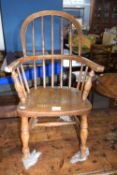 A elm seated Windsor type stick back chair , 70cm high