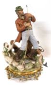 A large Capodimonte style figure of a fisherman on gilt decorated base, 35cm high