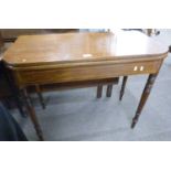 A Victorian mahogany D shape tea table with folding top raised on turned legs (Item 34 on vendor