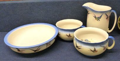 A Victorian jug and basin set together with two matching chamber pots, soap dishes and covers, all