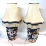 Pair of Chinese porcelain lamp bases with shades with polychrome designs