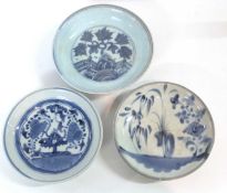 Group of three Chinese porcelain dishes all with blue and white designs including one Ming style
