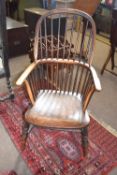 A 19th Century elm seated stick back Windsor type chair on turned legs