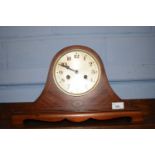 An Edwardian mahogany veneered arch cased mantel clock