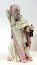 A n early 19th century porcelain figure of a monk with JP mark to base possibly for Jacob Petit (af)
