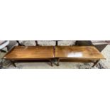 A pair of 20th Century hardwood coffee tables of rectangular form with base shelves, 126cm long (