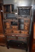 A late 19th or early 20th Century Chinese hardwood side cabinet with a abstract design with