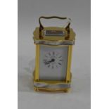 L'Eppe, a good quality miniture carriage clock with brass and mother of pearl mounted body, 8.5cm
