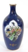 A Chinese porcelain bottle vase, the powder blue ground with gilt decoration, two reserves of