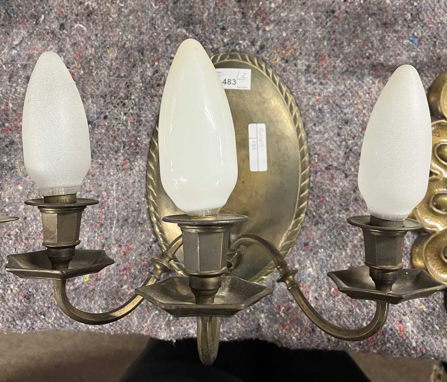 A pair of 20th Century brass three branch wall lights with oval panelled backs, 24cm high - Image 2 of 3