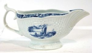 A Worcester porcelain sauce boat of fleeted form with panels depicting fisherman with Chinoiserie