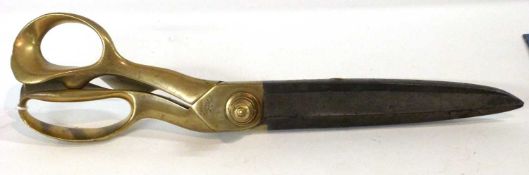 A large heavy pair of dress making scissors, the brass body marked Wilkinson & Son Makers,