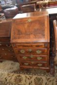 Small Georgian style walnut bureau of narrow form with full front opening to an interior with