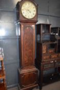 A Georgian mahogany cased long case clock with circular white painted dial, with Roman numerals