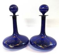 Two Bristol blue glass ships decanters, both 19th Century with gilt detailing, one for brandy the