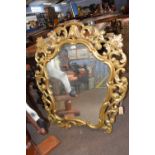 A Georgian style gilt wood wall mirror with pierced foliate frame, 103cm high (a/f)