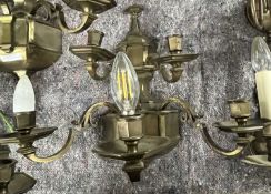 A trio of 20th Century five branch wall lights with bronzed finish, 40cm high