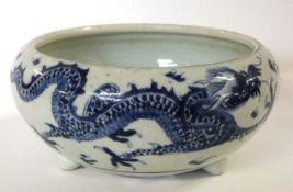 A Chinese bowl Qing Dynasty decorated in blue and white with the dragon chasing the flaming pearl,