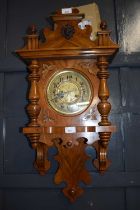 Late 19th or early 20th Century continental walnut cased wall clock set in an architectural case