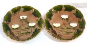 A pair of German pottery Art Nouveau plates together with a German porcelain figure of a gentleman