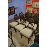 A set of six mahogany Heppelwhite style shield back mahogany dining chairs created with bell husk