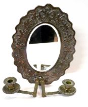 A copper Arts & Crafts hall mirror with two candle sconces