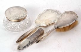 Hallmarked silver three piece mounted dressing table wares including hand mirror, hairbush and glass