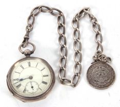 A silver pocket watch with silver watch chain, suspending a mounted two and a half shilling coin