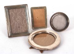 Mixed Lot: A George VI silver photograph frame of large plain circular shape, easel backed,