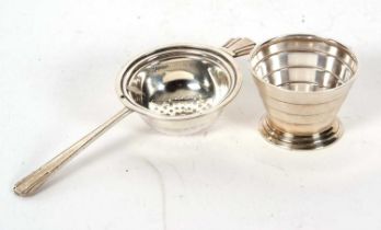 An Art Deco silver tea strainer and bowl, both hallmarked Birmingham 1937, makers mark for Barker