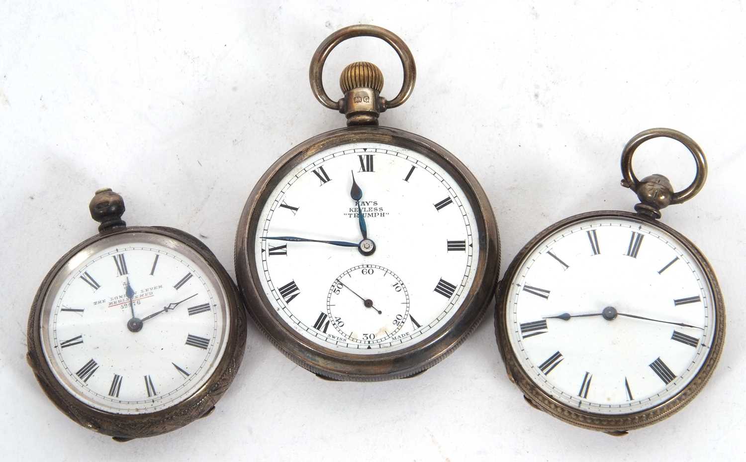 A mixed lot of three pocket watches, two are hallmarked and the other is stamped fine silver, two